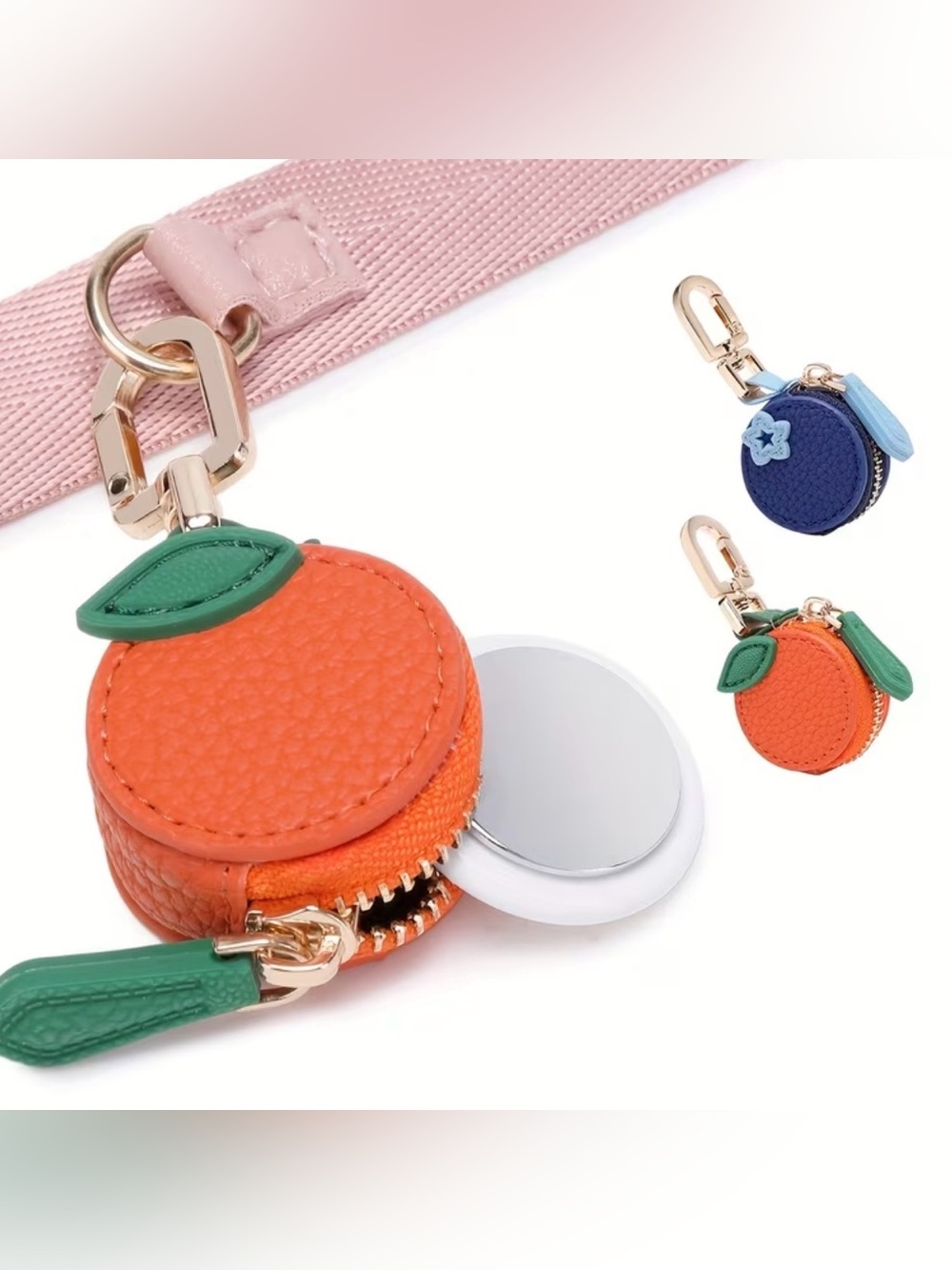 Air Tag Case Keychains,  one blueberry and one orange. Price Includes both